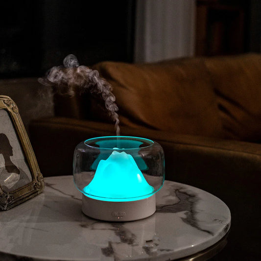 Premium aroma diffuser with serene mountain landscape design and multi-coloured night light for relaxation and well-being