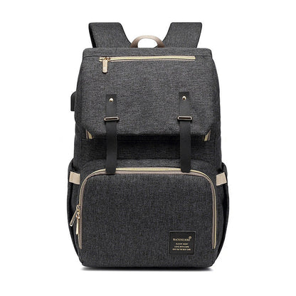 Versatile mummy bag with stroller hooks, side pockets, and zippered compartments for storing baby essentials