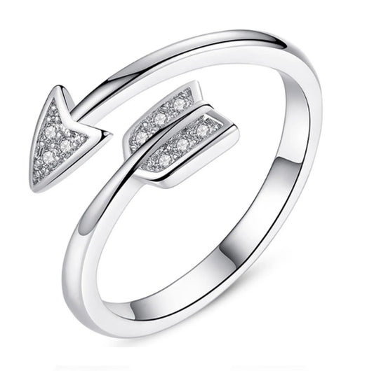 Copper arrow-shaped ring with a sleek, polished finish and a touch of subtle shimmer for a sophisticated, modern look.