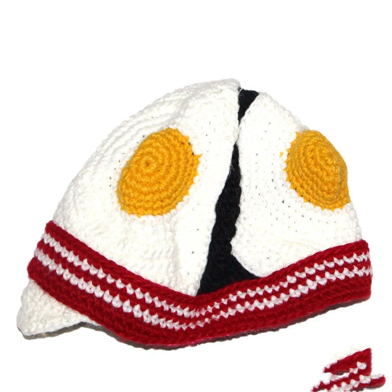 Hand-knitted egg hat in white with stripe pattern, perfect for winter and parties