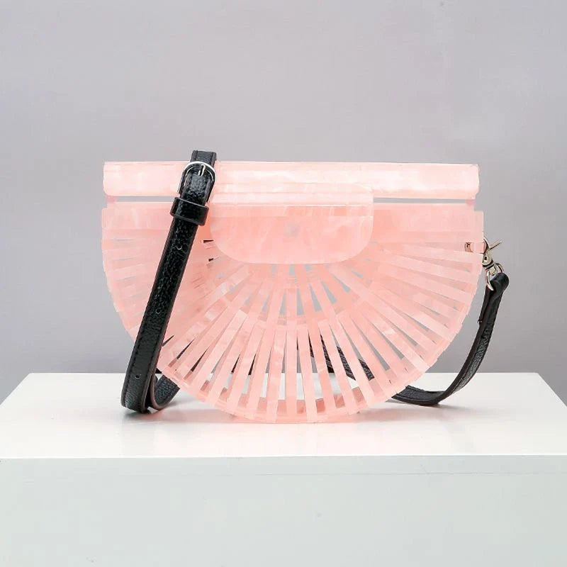 Stylish acrylic cross-body bag in various colors and strap designs, perfect for everyday use and fashion-forward British style.