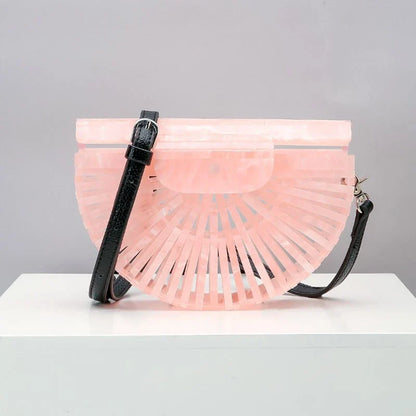 Stylish acrylic cross-body bag in various colors and strap designs, perfect for everyday use and fashion-forward British style.