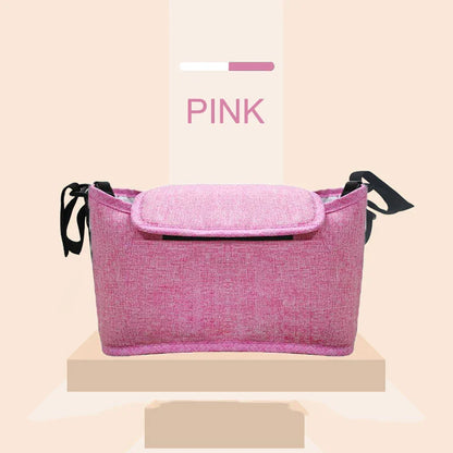 Stylish baby pram organiser bag made of premium cotton and linen materials, featuring various compartments and colour options to keep your child's essentials organised.