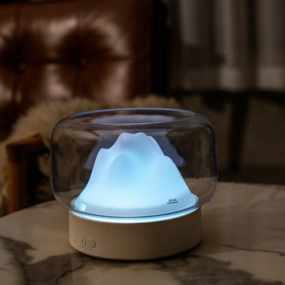 Premium aroma diffuser with serene mountain landscape design and multi-coloured night light for relaxation and well-being