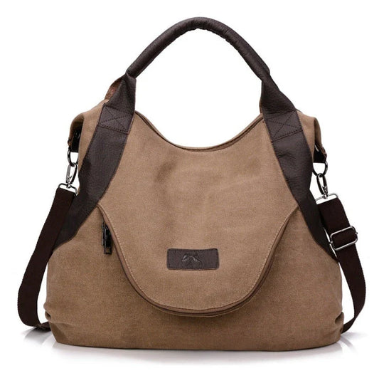 Stylish and versatile canvas shoulder bag with premium brass hardware and thoughtful interior organisation