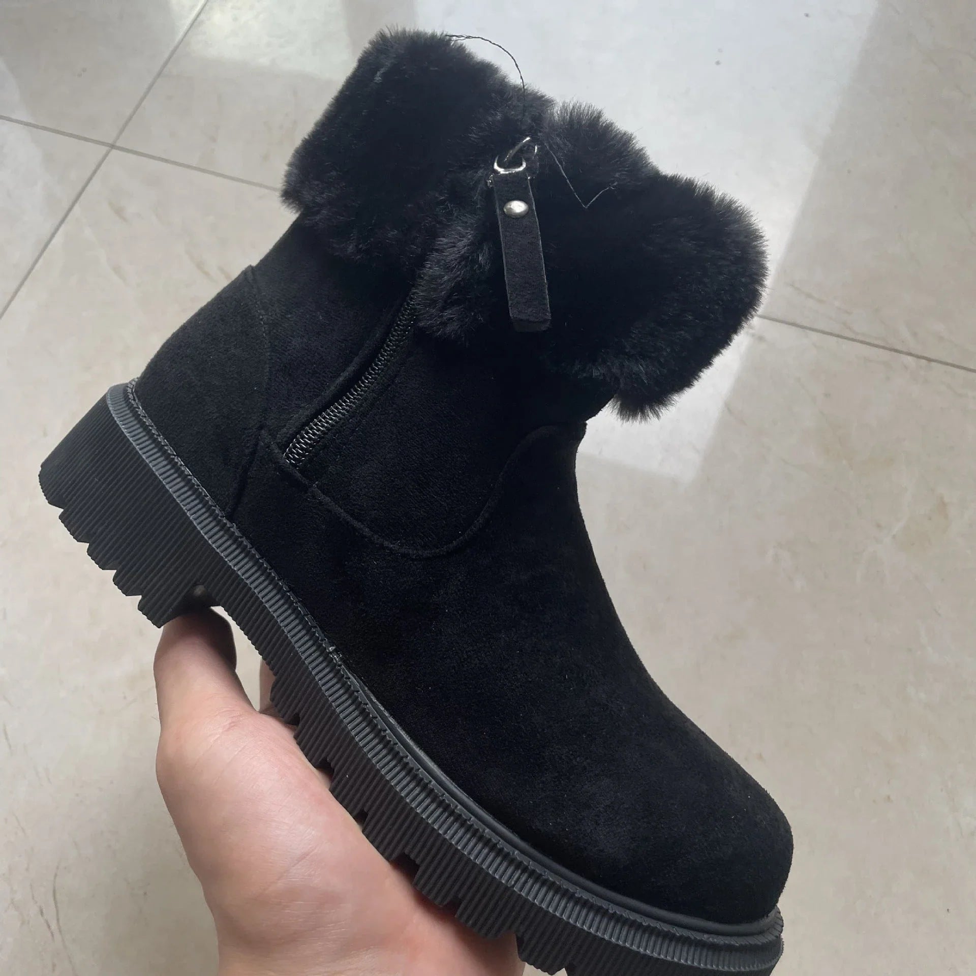 Cosy winter boots with plush lining, side zipper, and rubber soles for women in beige and black colours