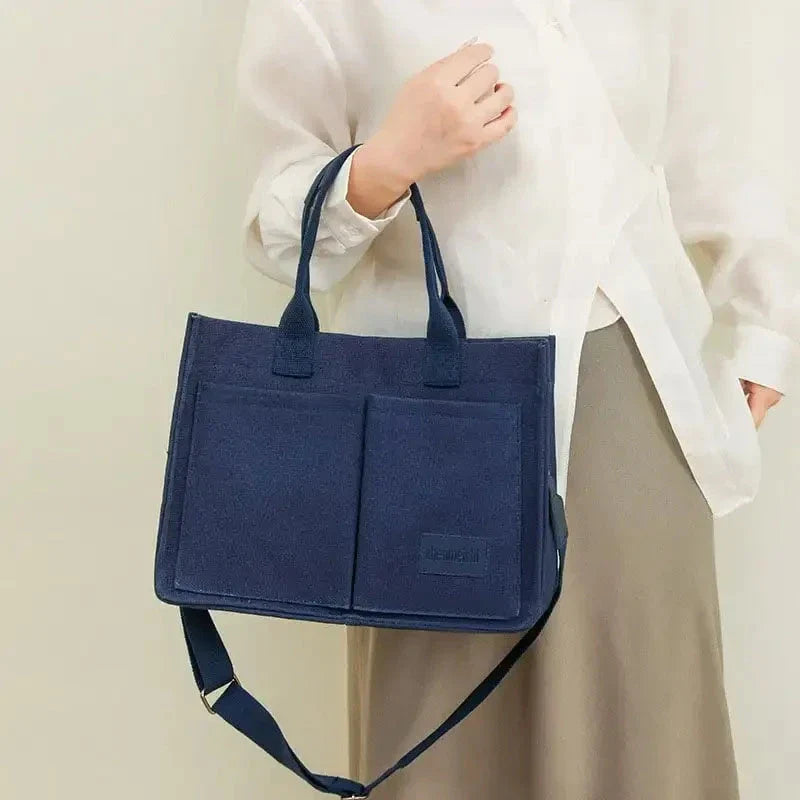 Stylish and durable canvas tote bag with multiple pockets for everyday use