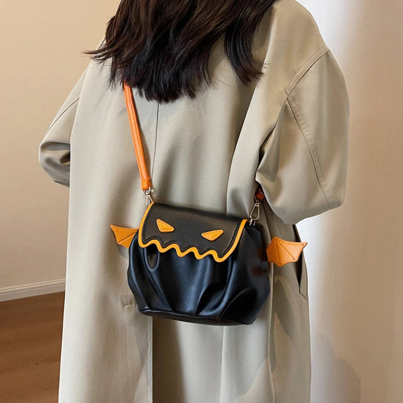 Halloween pumpkin cartoon crossbody bag with small wings in black, beige, or orange