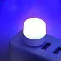 Compact USB LED night light with soft glow for reading and sleep