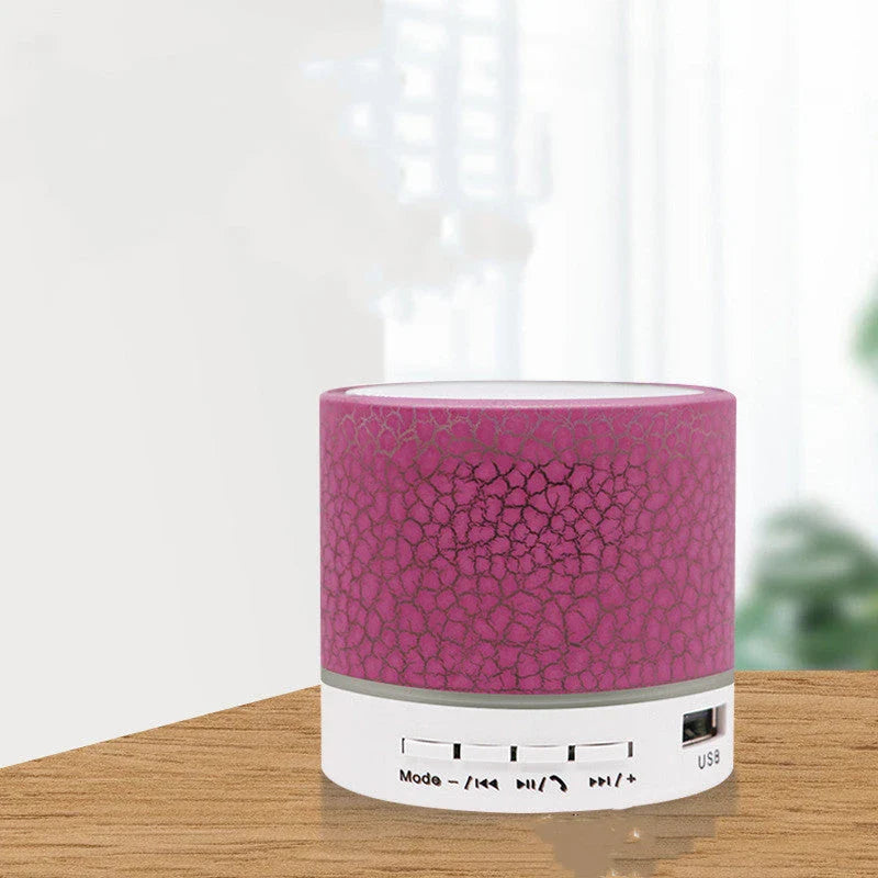 Portable Bluetooth speaker with colorful changing lights, high-quality audio, and durable design for on-the-go use