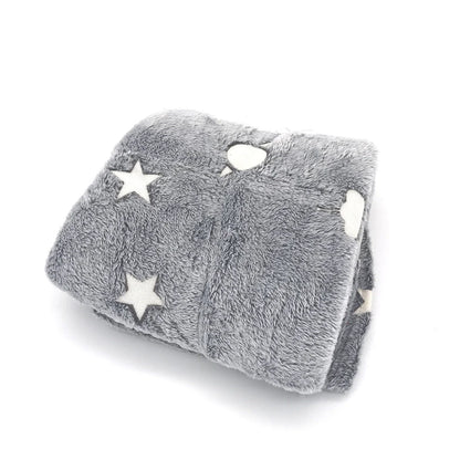Glowing polyester wool blanket with stars and moons design, perfect for cosy nights