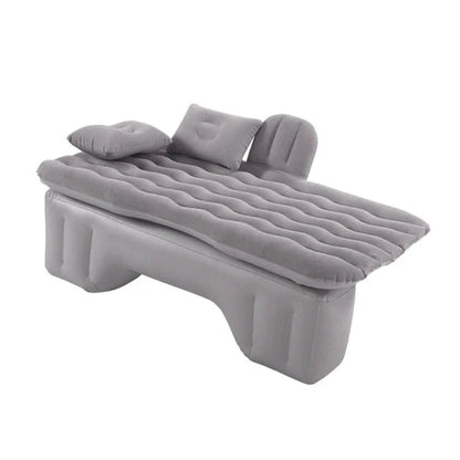 Inflatable car mattress with pillows in various colors, perfect for comfortable road trips and outdoor adventures
