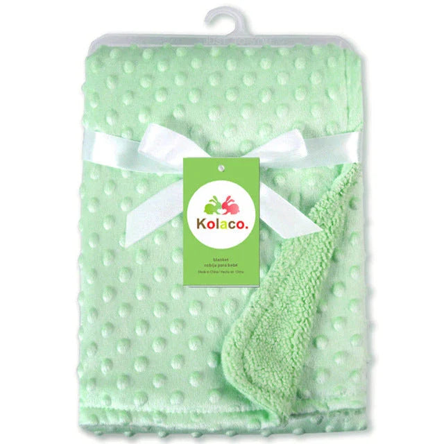 Premium plush baby blanket in various colours, perfect for swaddling, strolling, and creating a cosy nursery environment