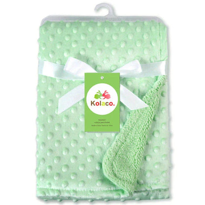 Premium plush baby blanket in various colours, perfect for swaddling, strolling, and creating a cosy nursery environment