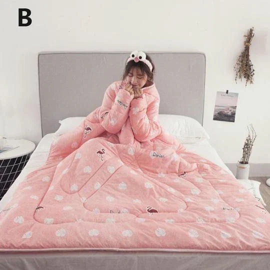 Cozy quilted lounger with sleeves in various colors and sizes, perfect for year-round indoor comfort and relaxation.