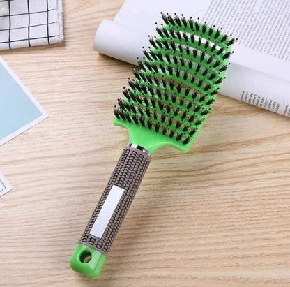 A premium hair brush with a sleek design, featuring soft bristles and a rounded massage function for healthy, detangled hair