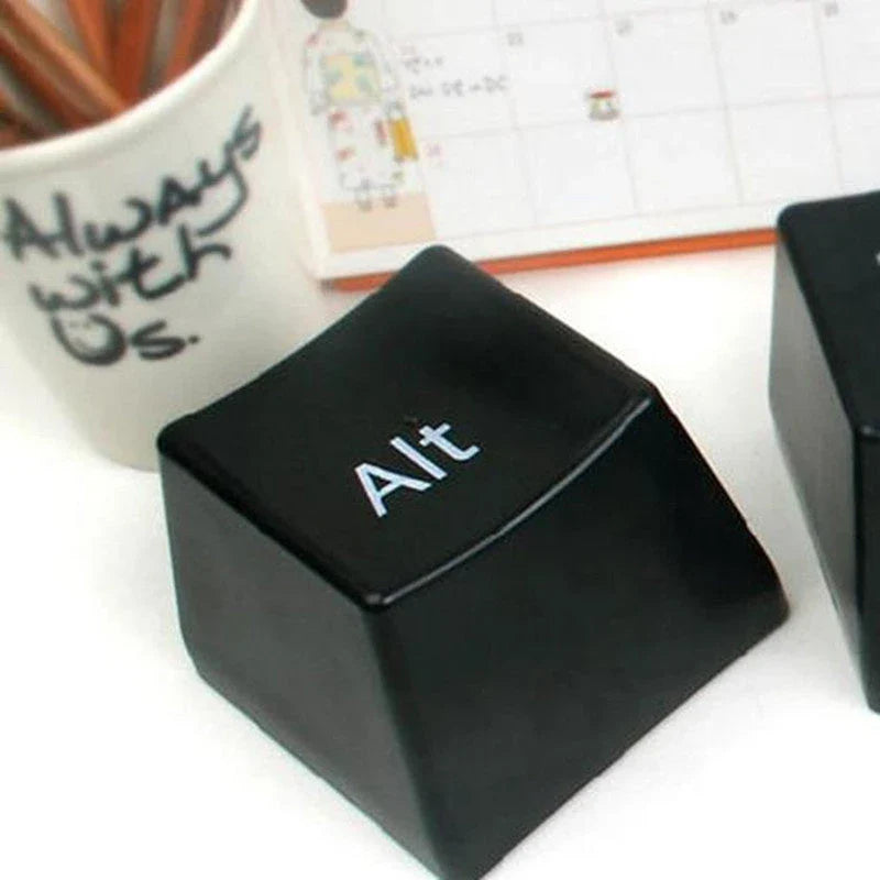 Three keyboard-inspired mugs in white and black colours, arranged on a wooden tray with a minimalist desk setting
