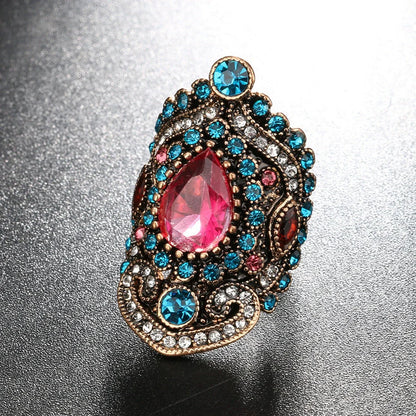 Elegant bohemian-style jewellery set featuring necklaces, earrings, and rings in a variety of colours and sizes