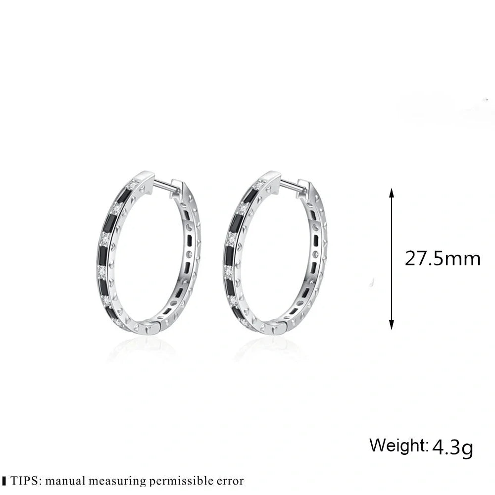 A pair of elegant black zircon earrings with a round, geometric design made of premium copper