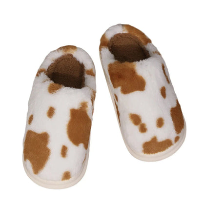Cozy cow print plush slippers with a non-slip sole, perfect for indoor comfort and warmth