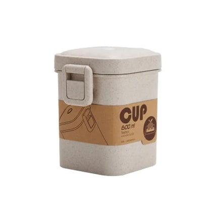 A stylish microwave-safe lunch box with a removable soup mug in various colours, including pink, green, and apricot