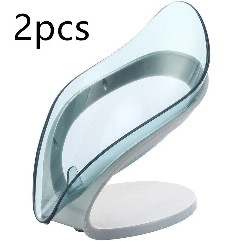 Elegant leaf-shaped soap dish with self-draining design and stable triangular shape, made of durable ABS material