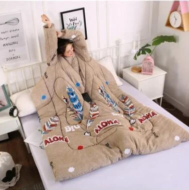 Cozy quilted lounger with sleeves in various colors and sizes, perfect for year-round indoor comfort and relaxation.