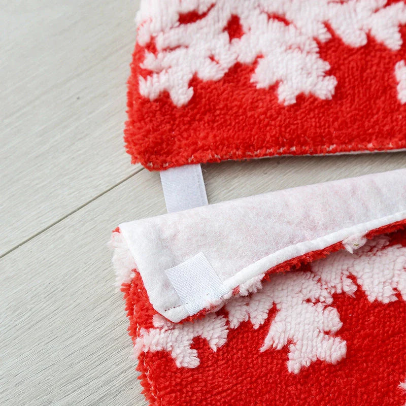 Soft, plush Christmas tree carpet skirt in red and grey, adding festive charm to a living room