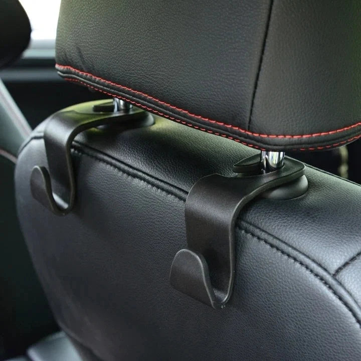 Auto Headrest Hangers in black, hooking onto car seat for organisation