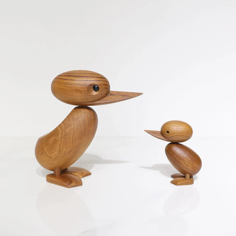 Handcrafted teak wood duck toy in duck yellow, available in large and small sizes