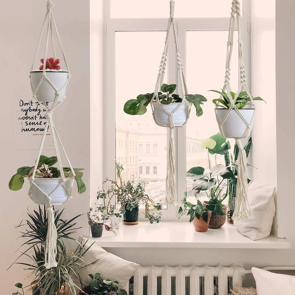 Handmade bohemian macrame hanging plant baskets in a set of four, perfect for home decor.