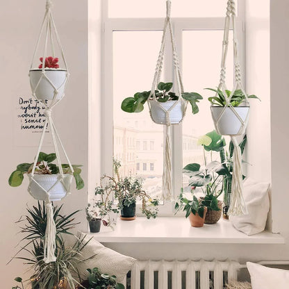 Handmade bohemian macrame hanging plant baskets in a set of four, perfect for home decor.