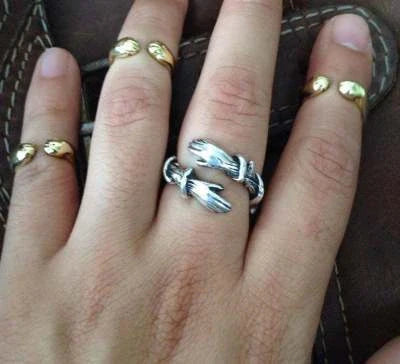Elegant Adjustable Love Hands Embracing Ring in gold and silver, a perfect symbol of affection