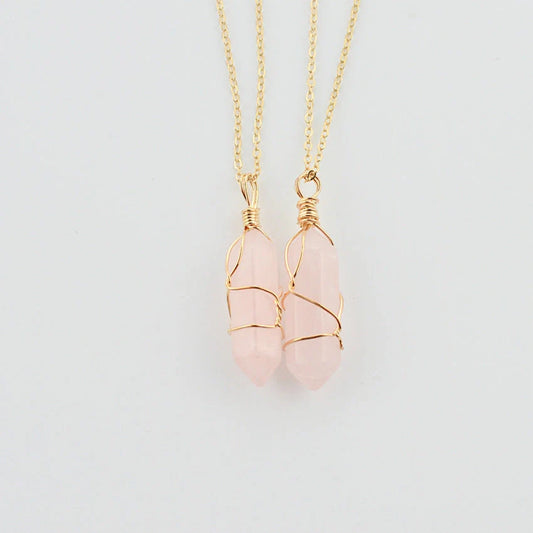 Elegant hexagonal quartz crystal necklace pendant on gold chain
