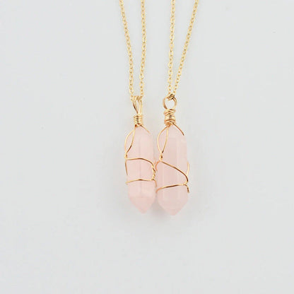Elegant hexagonal quartz crystal necklace pendant on gold chain