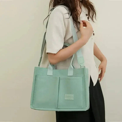Stylish and durable canvas tote bag with multiple pockets for everyday use