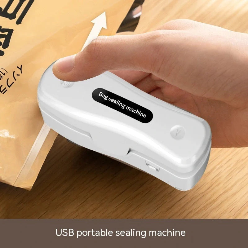 Compact USB mini sealing machine for kitchen food preservation in black and milky white