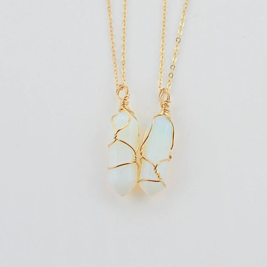 Elegant hexagonal quartz crystal necklace pendant on gold chain