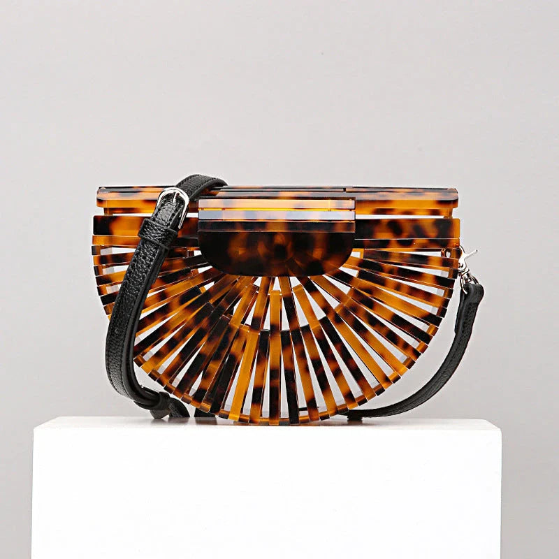 Stylish acrylic cross-body bag in various colors and strap designs, perfect for everyday use and fashion-forward British style.