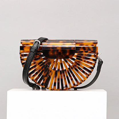 Stylish acrylic cross-body bag in various colors and strap designs, perfect for everyday use and fashion-forward British style.
