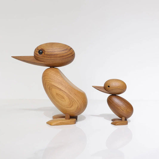 Handcrafted teak wood duck toy in duck yellow, available in large and small sizes