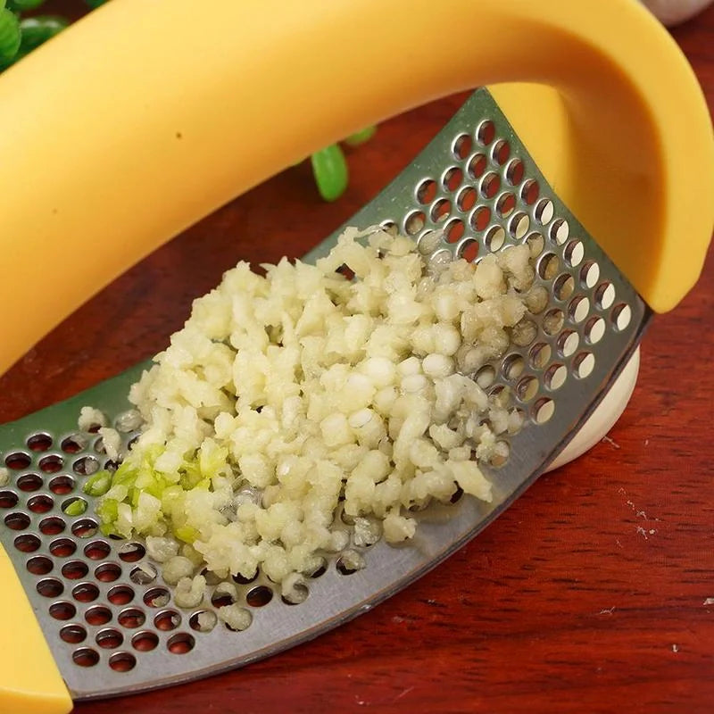 Stainless steel garlic press with ergonomic handle for easy mashing