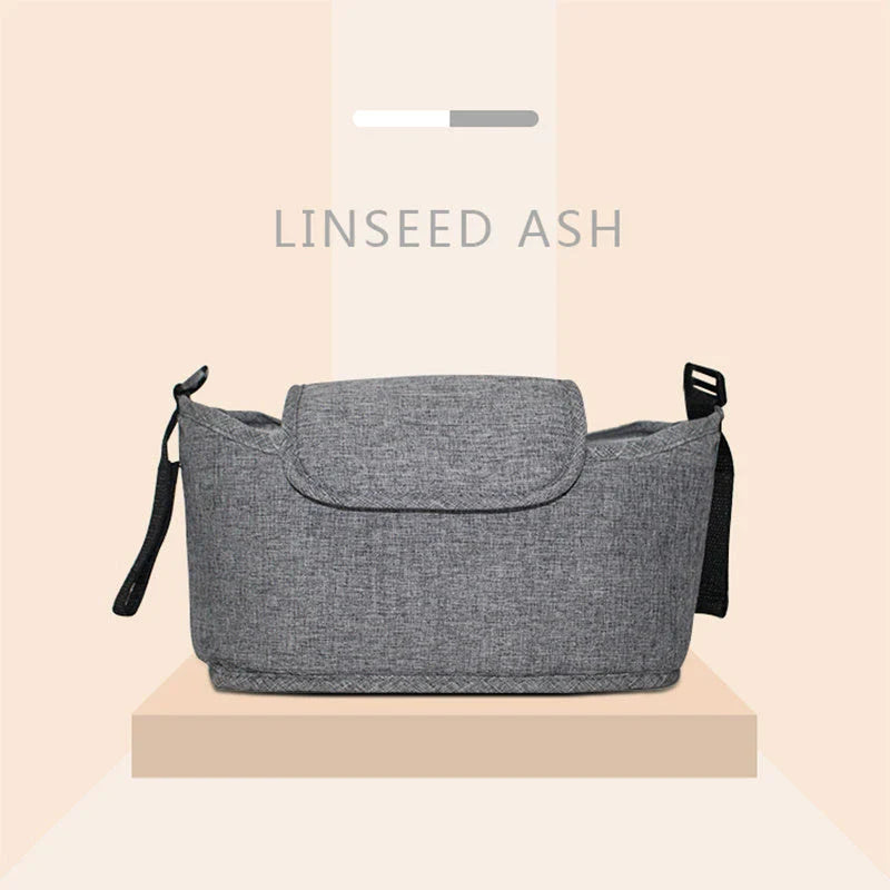 Stylish baby pram organiser bag made of premium cotton and linen materials, featuring various compartments and colour options to keep your child's essentials organised.