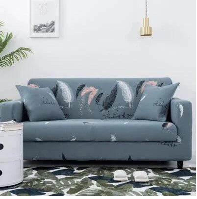 Stretchable geometric print sofa cover on a three-seater sofa