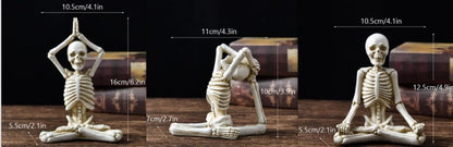 Haunting Halloween desktop ornaments, featuring intricate resin skulls and skeletons in black and vintage white finishes