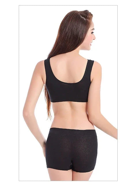 Supportive cotton sports bra with crossover design for lift and support, preventing sagging and bra lines