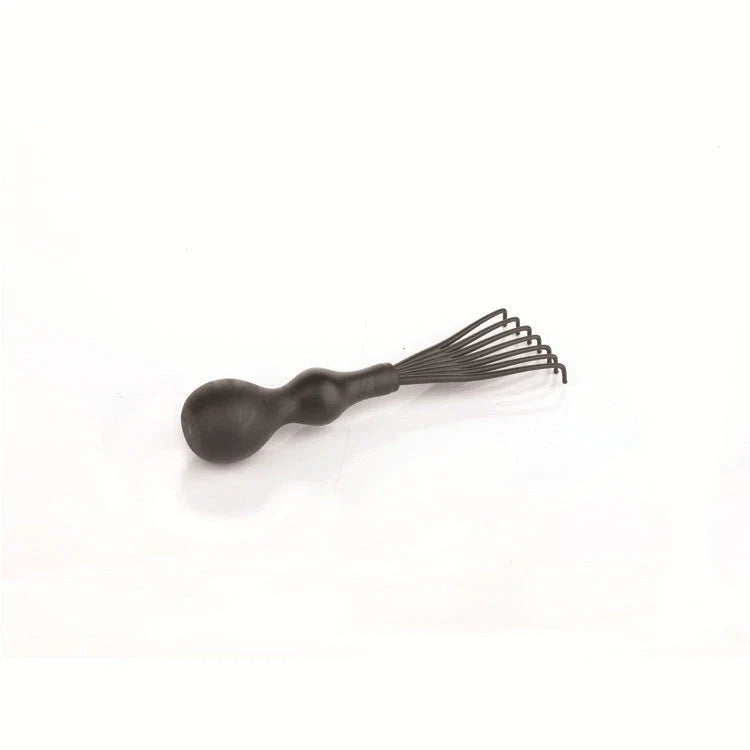 A premium hair brush with a sleek design, featuring soft bristles and a rounded massage function for healthy, detangled hair