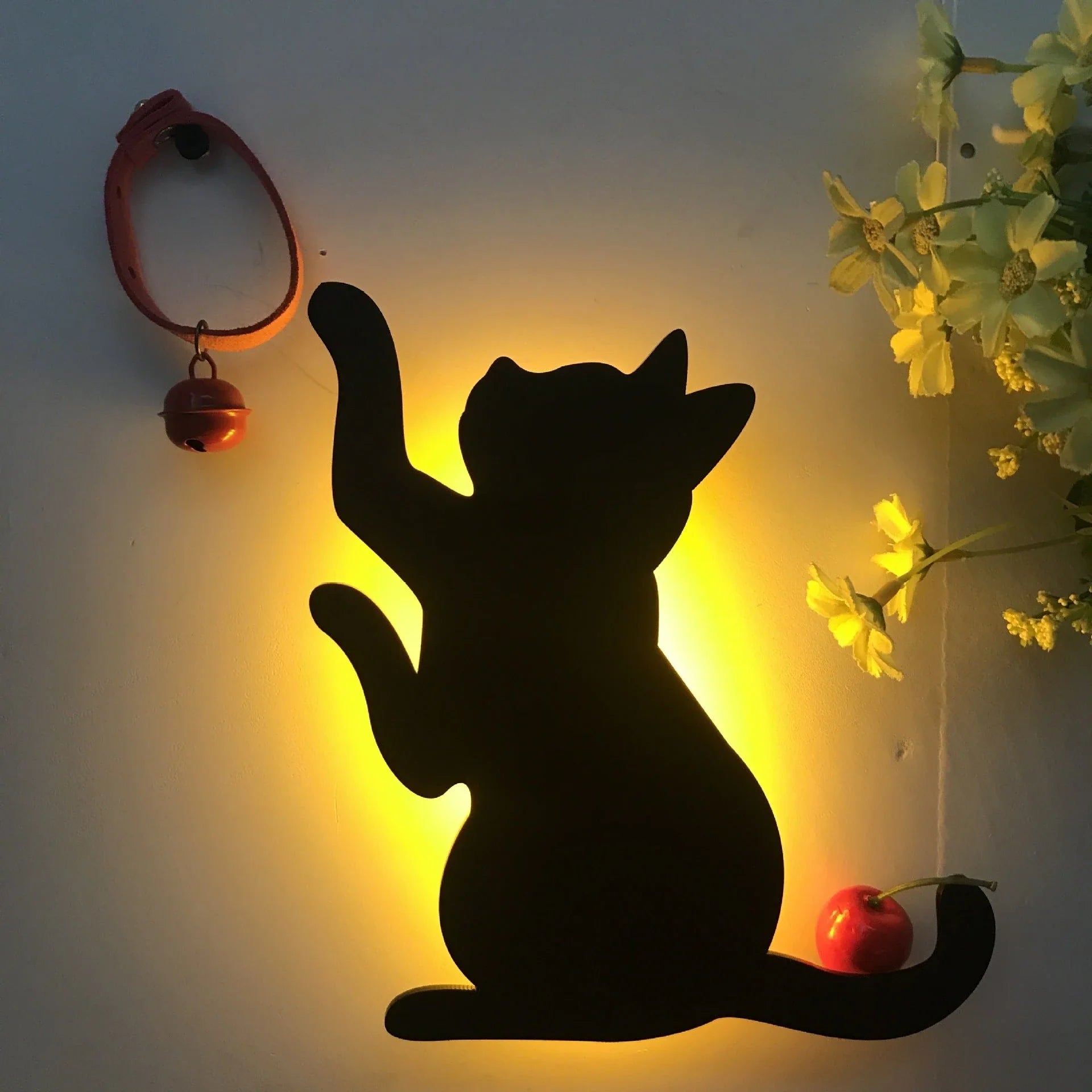 A stylish cat-shaped smart sensor night light that automatically illuminates a room when motion is detected, creating a warm and cozy atmosphere.