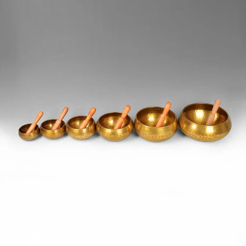 A handcrafted Tibetan singing bowl made of copper, used for meditation and relaxation.