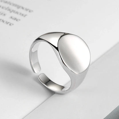 Adjustable oval smooth ring with polished electroplated finish in platinum and gold
